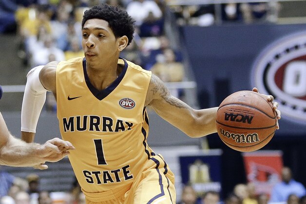 Murray State guard Cameron Payne (1) drives against Belmont guard Reece Chamberlain (22) during the first half of an NCAA college basketball game in the final of the Ohio Valley Conference tournament Saturday, March 7, 2015, in Nashville, Tenn. (AP Photo/Mark Humphrey)