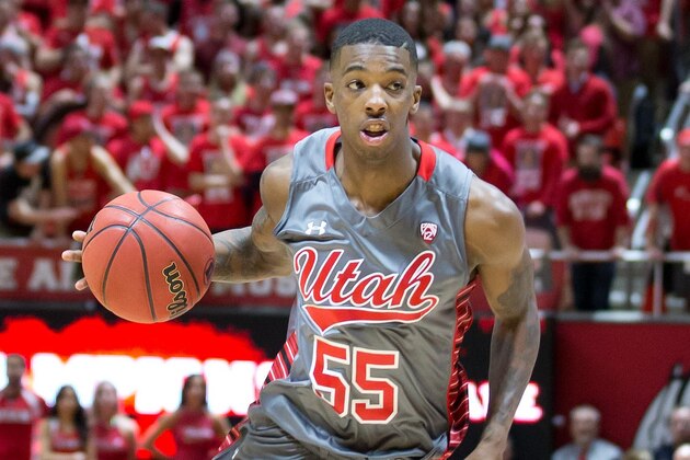 Feb 28, 2015; Salt Lake City, UT, USA; Utah Utes guard Delon Wright (55) dribbles the ball as Arizona Wildcats forward Rondae Hollis-Jefferson (23) defends during the second half at Jon M. Huntsman Center. Arizona won 63-57. Mandatory Credit: Russ Isabella-USA TODAY Sports