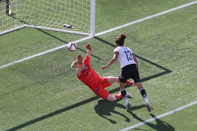 OTTAWA, ON - JUNE 20: Celia Sasic #13 of Germany kicks the ball past Hedvig Lindahl #1 of Sweden for her second goal of the game during the FIFA Women's World Cup Canada 2015 round of 16 match between Germany and Sweden at Lansdowne Stadium on June 20, 2015 in Ottawa, Canada.  (Photo by Jana Chytilova/Getty Images)