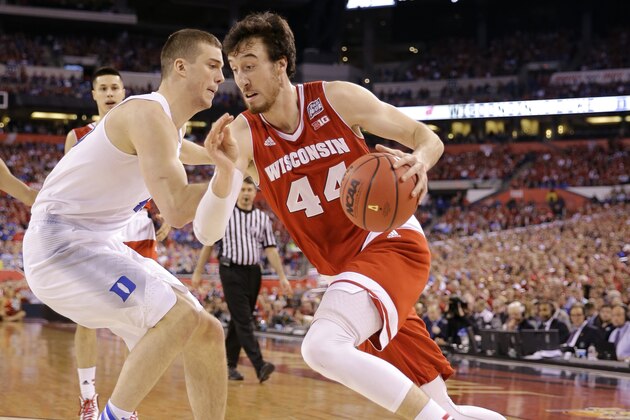 Wisconsin's Frank Kaminsky drives past Duke's Marshall Plumlee, left, during the first half of the NCAA Final Four college basketball tournament championship game Monday, April 6, 2015, in Indianapolis. (AP Photo/David J. Phillip)