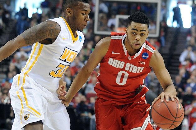 Ohio State guard D'Angelo Russell, right, drives on Virginia Commonwealth guard Melvin Johnson during the first half of an NCAA college basketball second-round game in Portland, Ore., Thursday, March 19, 2015. (AP Photo/Greg Wahl-Stephens)