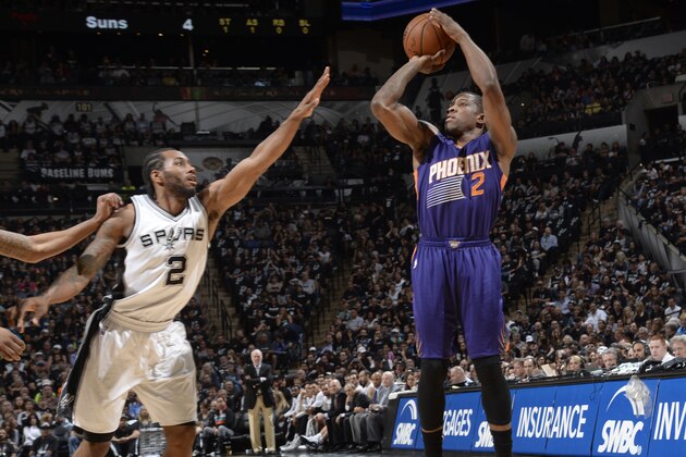 SAN ANTONIO - APRIL 12: Eric Bledsoe #2 of the Phoenix Suns takes a shot against the San Antonio Spurs at the AT&T Center on April 12, 2014 in San Antonio, Texas. NOTE TO USER: User expressly acknowledges and agrees that, by downloading and or using this photograph, user is consenting to the terms and conditions of the Getty Images License Agreement. Mandatory Copyright Notice: Copyright 2015 NBAE (Photos by D. Clarke Evans/NBAE via Getty Images)