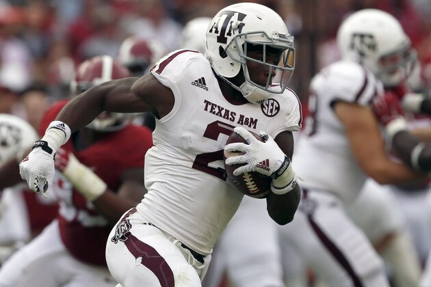 Texas A&M wide receiver Speedy Noil (2) carries the ball on a kick-return during the first half of an NCAA college football game against Alabama, Saturday, Oct. 18, 2014, in Tuscaloosa, Ala. (AP Photo/Butch Dill)