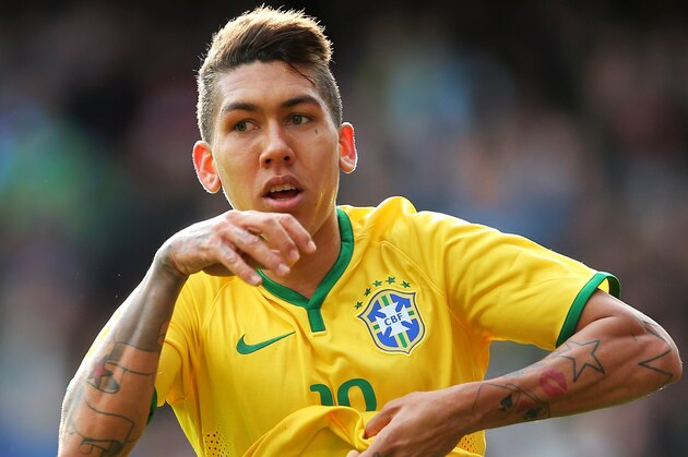 LONDON, ENGLAND - MARCH 29:  Firmino of Brazil celebrates after scoring the opening goal during the international friendly match between Brazil and Chile at the Emirates Stadium on March 29, 2015 in London, England.  (Photo by Paul Gilham/Getty Images)