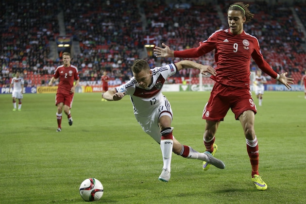 Germany’s Joshua Kimmich, left and Denmark’s Yussuf Poulsen challenge for the ball during the Euro U21 soccer championship group A match between Germany and Denmark, at the Eden stadium stadium in Prague, Czech Republic, Saturday, June 20, 2015. (AP Photo/Petr David Josek)