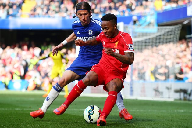 LONDON, ENGLAND - MAY 10:  Raheem Sterling of Liverpool is challenged by Filipe Luis of Chelsea during the Barclays Premier League match between Chelsea and Liverpool at Stamford Bridge on May 10, 2015 in London, England.  (Photo by Clive Rose/Getty Images)