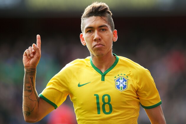 LONDON, ENGLAND - MARCH 29:  Firmino of Brazil celebrates after scoring the opening goal during the international friendly match between Brazil and Chile at the Emirates Stadium on March 29, 2015 in London, England.  (Photo by Paul Gilham/Getty Images)