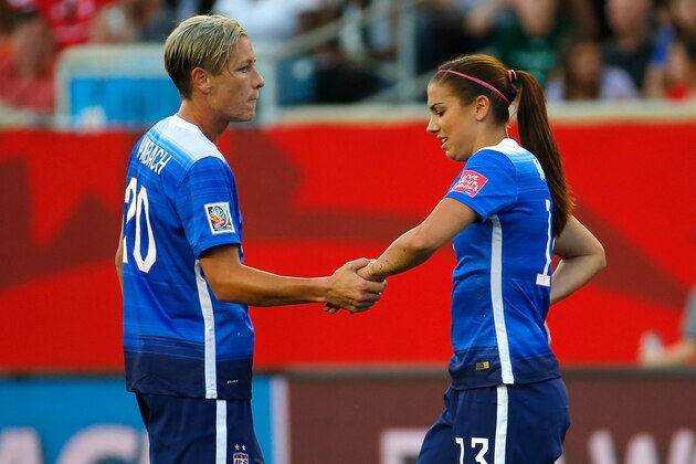 WINNIPEG, MB - JUNE 12:  Abby Wambach #20 and Alex Morgan #13 of the United States of America against Sweden during the FIFA Women's World Cup Canada 2015 match between USA and Sweden at Winnipeg Stadium on June 12, 2015 in Winnipeg, Canada.  (Photo by Kevin C. Cox/Getty Images)