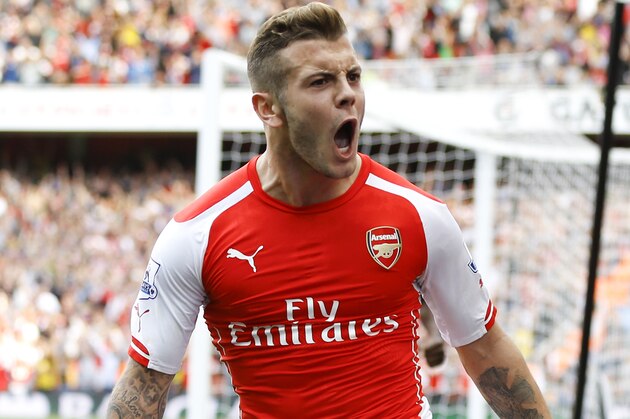 Arsenal's Jack Wilshere celebrates scoring a goal during the English Premier League soccer match between Arsenal and Manchester City at Emirates Stadium in London, Saturday, Sept. 13, 2014. (AP Photo/Kirsty Wigglesworth)