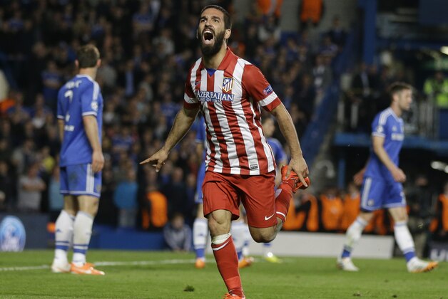 Atletico's Arda Turan celebrates after scoring his soda's 3rd goal during the Champions League semifinal second leg soccer match between Chelsea and Atletico Madrid at Stamford Bridge Stadium in London Wednesday, April 30, 2014. (AP Photo/Kirsty Wigglesworth)