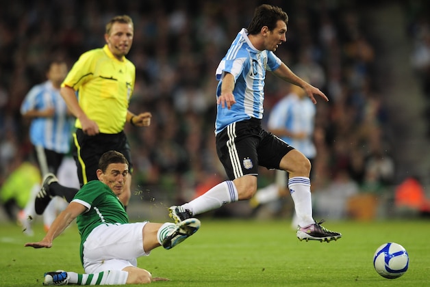 DUBLIN, IRELAND - AUGUST 11:  Lionel Messi of Argentina avoids a challenge from Keith Andrews of Republic of Ireland during the International Friendly match between Republic of Ireland and Argentina at the Aviva Stadium on August 11, 2010 in Dublin, Ireland.  (Photo by Shaun Botterill/Getty Images)