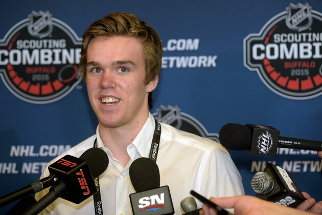 Connor McDavid, the OHL's Player of the year and number one pick in the upcoming 2015 NHL Draft, answers a question about his experience during the NHL Combine Friday, June 5, 2015, in Buffalo, N.Y. (AP Photo/Gary Wiepert)