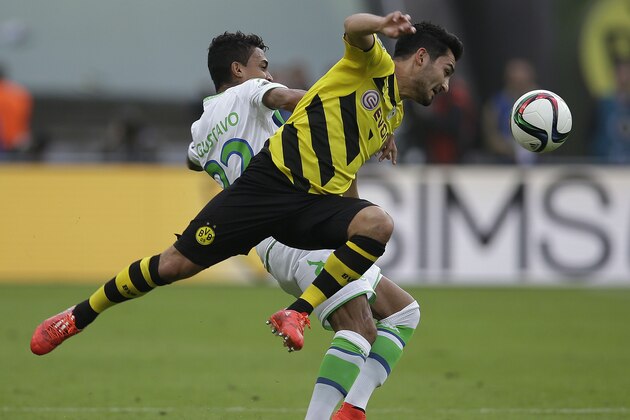 Dortmund's Ilkay Gundogan, front, and Wolfsburg's Luiz Gustavo from Brazil challenge for the ball during the German soccer cup final match between Borussia Dortmund and VfL Wolfsburg in Berlin, Germany, Saturday, May 30, 2015. (AP Photo/Michael Sohn) Dortmund's Ilkay Gundogan, front, and Wolfsburg's Luiz Gustavo from Brazil challenge for the ball during the German soccer cup final match between Borussia Dortmund and VfL Wolfsburg in Berlin, Germany, Saturday, May 30, 2015. (AP Photo/Michael Sohn)