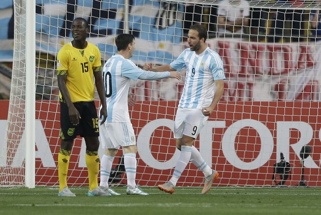 Argentina's Gonzalo Higuain, right, celebrates with his teammate Argentina's Lionel Messi, after scoring the opening goal against Jamaica during a Copa America Group B soccer match at the Sausalito Stadium in Vina del Mar, Chile, Saturday, June 20, 2015. (AP Photo/Ricardo Mazalan)