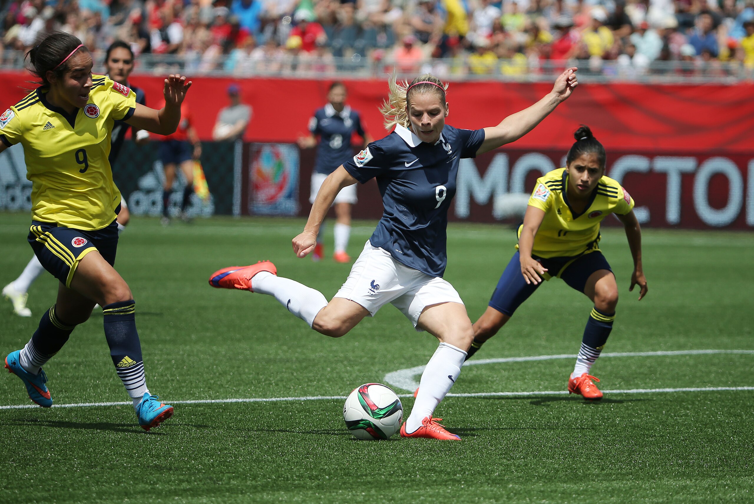 Jun 13, 2015; Moncton, New Brunswick, CAN; France forward Eugenie Le Sommer (9) shoots the ball against Colombia during the first half in a Group F soccer match in the 2015 FIFA women's World Cup at Moncton Stadium. Mandatory Credit: Matt Kryger-USA TODAY Sports