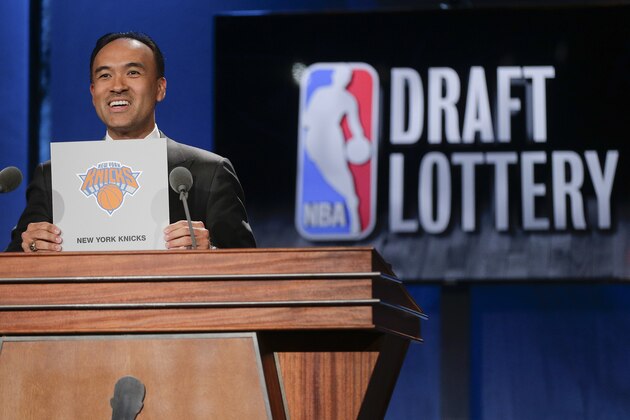 NBA Deputy Commissioner Mark Tatum announces that the New York Knicks have the fourth pick in the draft, during the NBA basketball draft lottery, Tuesday, May 19, 2015, in New York. (AP Photo/Julie Jacobson)