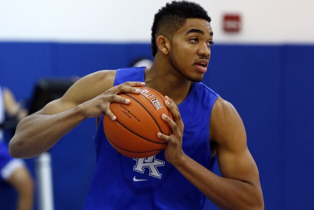 Kentucky's Karl-Anthony Towns pulls down a rebound in practice during the team's NCAA college basketball media day, Thursday, Oct. 16, 2014, in Lexington, Ky. (AP Photo/James Crisp)