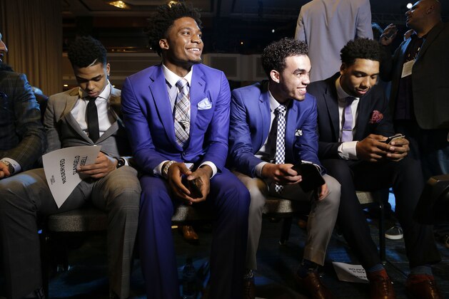 NBA basketball draft prospects, from left, D'Angelo Russell, Justice Winslow, Tyus Jones and Jahlil Okafor wait for the start of the draft lottery Tuesday, May 19, 2015, in New York. (AP Photo/Julie Jacobson)