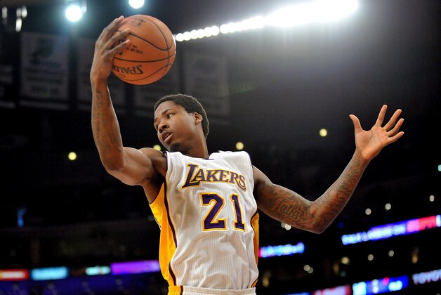April 12, 2015; Los Angeles, CA, USA; Los Angeles Lakers  forward Ed Davis (21) grabs a rebound against the Dallas Mavericks during the first half at Staples Center. Mandatory Credit: Gary A. Vasquez-USA TODAY Sports