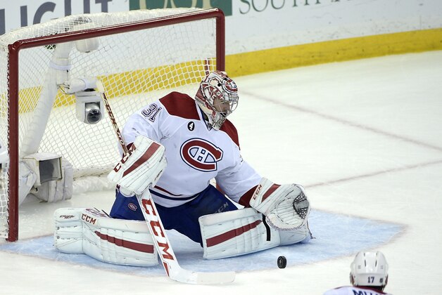 Montreal Canadiens goalie Carey Price (31) blocks a shot during the third period of Game 4 of a second-round NHL Stanley Cup hockey playoff series against the Tampa Bay Lightning in Tampa, Fla., Thursday, May 7, 2015. The Canadiens won 6-2.(AP Photo/Phelan M. Ebenhack)