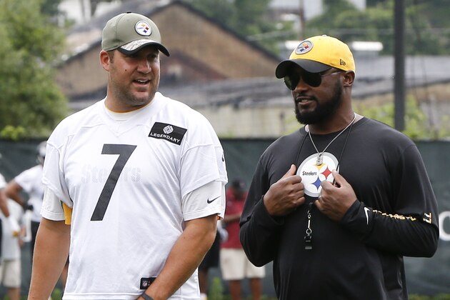 Pittsburgh Steelers quarterback Ben Roethlisberger (7) talks with head coach Mike Tomlin as they walk to the sideline during the NFL football minicamp, Thursday, June 18, 2015 in Pittsburgh. (AP Photo/Keith Srakocic)