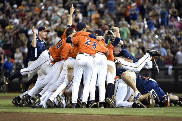 Virginia players celebrate beating Vanderbilt 4-2 in Game 3 of the best-of-three NCAA baseball College World Series finals at TD Ameritrade Park in Omaha, Neb., Wednesday, June 24, 2015. (AP Photo/Mike Theiler)