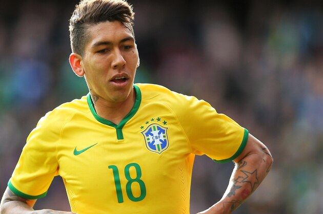 LONDON, ENGLAND - MARCH 29:  Firmino of Brazil celebrates after scoring the opening goal during the international friendly match between Brazil and Chile at the Emirates Stadium on March 29, 2015 in London, England.  (Photo by Paul Gilham/Getty Images)
