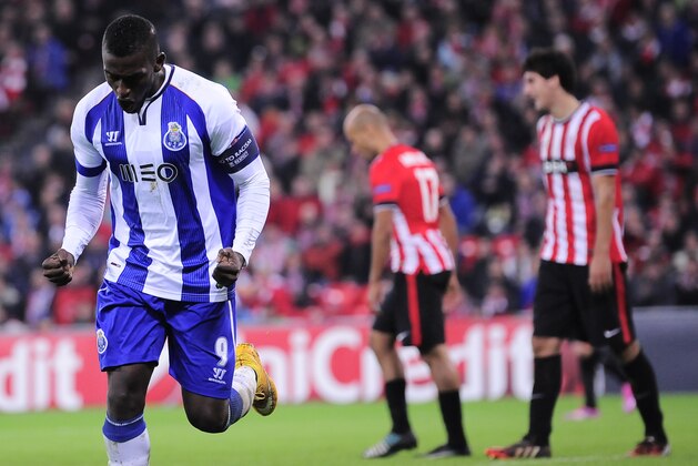 FC Porto's Jackson Martinez, left, celebrates after scoring his goal against Athletic Bilbao, during the Champions League Group H soccer match between Athletic Bilbao and FC Porto, at San Mames stadium, in Bilbao, northern Spain, Wednesday, Nov. 5, 2014. (AP Photo/Alvaro Barrientos)