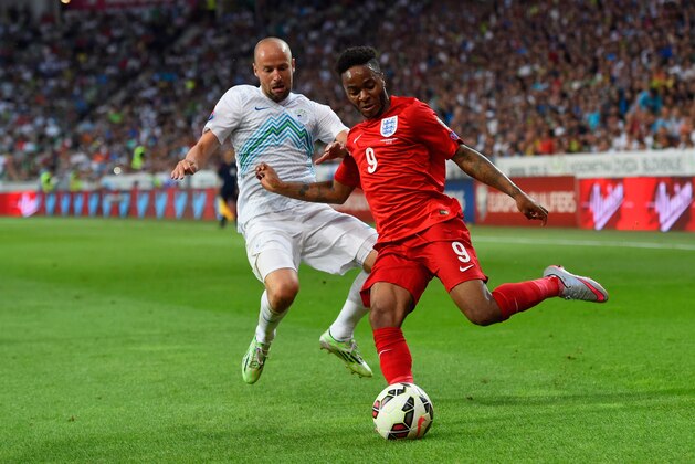LJUBLJANA, SLOVENIA - JUNE 14:  Raheem Sterling of England holds off Miso Brecko of Slovenia during the UEFA EURO 2016 Qualifier between Slovenia and England on at the Stozice Arena on June 14, 2015 in Ljubljana, Slovenia.  (Photo by Stu Forster/Getty Images)