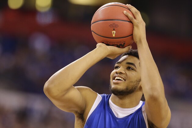 Kentucky's Karl-Anthony Towns shoots during a practice session for the NCAA Final Four tournament college basketball semifinal game Friday, April 3, 2015, in Indianapolis. Kentucky plays Wisconsin on Saturday. (AP Photo/Michael Conroy) Kentucky's Karl-Anthony Towns shoots during a practice session for the NCAA Final Four tournament college basketball semifinal game Friday, April 3, 2015, in Indianapolis. Kentucky plays Wisconsin on Saturday. (AP Photo/Michael Conroy)