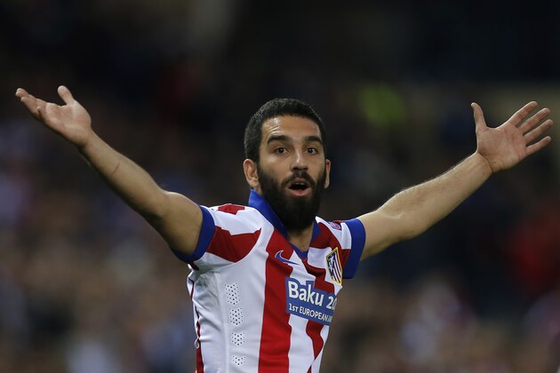 Atletico's Arda Turan reacts during the Champions League quarterfinal first leg soccer match between Atletico Madrid and Real Madrid at the Vicente Calderon stadium in Madrid, Spain, Tuesday, April 14, 2015. (AP Photo/Andres Kudacki)