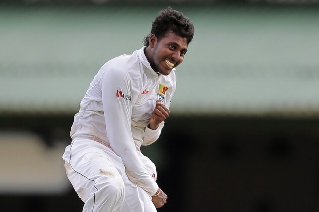 ALTERNATE CROP OF DEL127 - Sri Lanka's Tharindu Kaushal, left, jumps as he celebrates taking five wickets during the first day of the second test cricket match against Pakistan in Colombo, Sri Lanka, Thursday, June 25, 2015. (AP Photo/Eranga Jayawardena) ALTERNATE CROP OF DEL127 - Sri Lanka's Tharindu Kaushal, left, jumps as he celebrates taking five wickets during the first day of the second test cricket match against Pakistan in Colombo, Sri Lanka, Thursday, June 25, 2015. (AP Photo/Eranga Jayawardena)