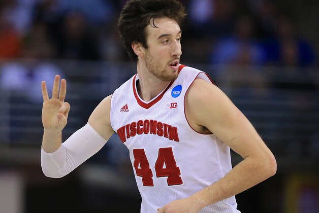 Wisconsin's Frank Kaminsky (44) gestures after hitting a three-pointer during the first half of an NCAA tournament college basketball game against Coastal Carolina in the Round of 64 in Omaha, Neb., Friday, March 20, 2015. (AP Photo/Nati Harnik)