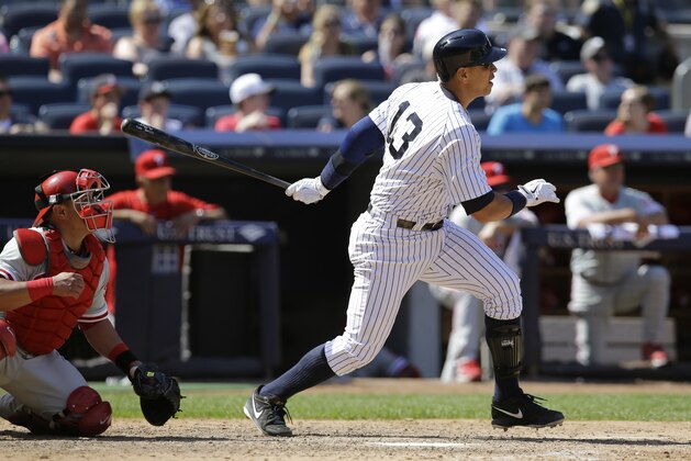 New York Yankees designated hitter Alex Rodriguez (13) hits a two-run single in the seventh inning of a baseball game against the Philadelphia Phillies at Yankee Stadium in New York, Wednesday, June 24, 2015.  (AP Photo/Kathy Willens)