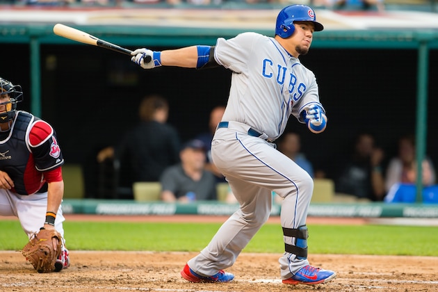 CLEVELAND, OH -  JUNE 17: Kyle Schwarber #12 of the Chicago Cubs hits an RBI single during the third inning against the Cleveland Indians at Progressive Field on June 17, 2015 in Cleveland, Ohio.  (Photo by Jason Miller/Getty Images)