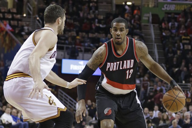 Portland Trail Blazers’ LaMarcus Aldridge drives against Cleveland Cavaliers' Kevin Love (0) during an NBA basketball game Wednesday, Jan. 28, 2015, in Cleveland. (AP Photo/Tony Dejak)