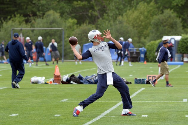 FOXBOROUGH, MA - JUNE 4: Tom Brady #12 of the New England Patriots throws a ball during organized team activities at Gillette Stadium on June 4, 2015 in Foxborough, Massachusetts. (Photo by Darren McCollester/Getty Images)