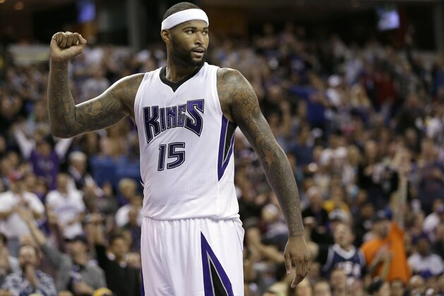 Sacramento Kings center DeMarcus Cousins pumps his first after the Kings scored in the closing moments of the Kings 108-101 win over the Los Angeles Lakers in an NBA basketball game in Sacramento, Calif., Sunday, Dec. 21, 2014. (AP Photo/Rich Pedroncelli)