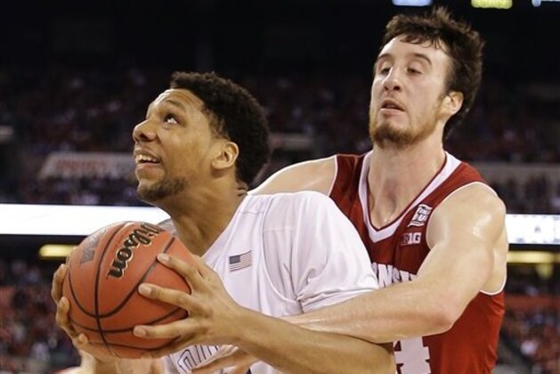 Duke's Jahlil Okafor (15) is fouled by Wisconsin's Frank Kaminsky (44) during the second half of the NCAA Final Four college basketball tournament championship game Monday, April 6, 2015, in Indianapolis. (AP Photo/David J. Phillip)