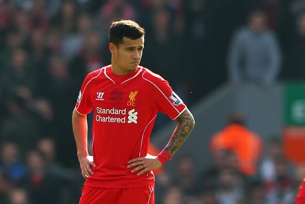 LIVERPOOL, ENGLAND - MARCH 22: Daniel Sturridge (L), Philippe Coutinho and Jordan Henderson of Liverpool look dejected after the opening goal by Juan Mata of Manchester United during the Barclays Premier League match between Liverpool and Manchester United at Anfield on March 22, 2015 in Liverpool, England.  (Photo by Alex Livesey/Getty Images)