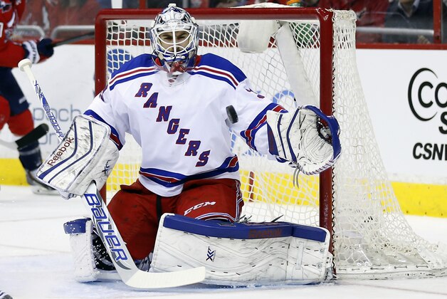 New York Rangers goalie Cam Talbot (33) blocks a shot in the first period of an NHL hockey game against the Washington Capitals, Wednesday, March 11, 2015, in Washington. (AP Photo/Alex Brandon)