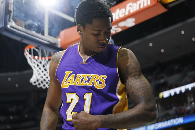 Los Angeles Lakers forward Ed Davis (21) flexes his arm after dunking the ball for a basket against the Denver Nuggets in the first quarter of an NBA basketball game Wednesday, April 8, 2015, in Denver. (AP Photo/David Zalubowski)
