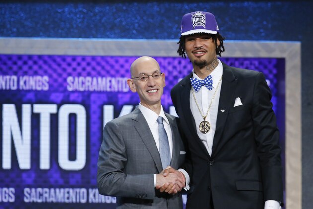 Willie Cauley-Stein, right, poses for photos with NBA Commissioner Adam Silver after being selected sixth overall by the Sacramento Kings during the NBA basketball draft, Thursday, June 25, 2015, in New York. (AP Photo/Kathy Willens)