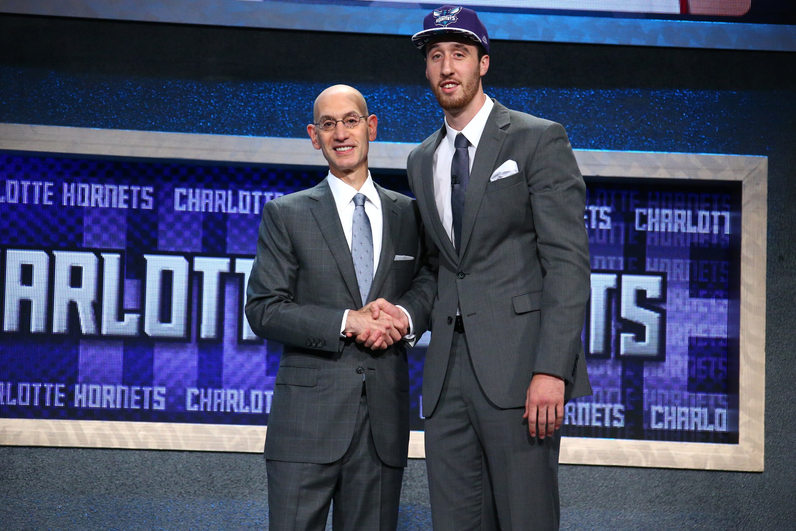 BROOKLYN, NY - JUNE 25: Frank Kaminsky shakes hands with NBA Commissioner Adam Silver after being selected number ninth overall by the Charlotte Hornets during the 2015 NBA Draft on June 25, 2015 at Barclays Center in Brooklyn, New York. NOTE TO USER: User expressly acknowledges and agrees that, by downloading and or using this photograph, User is consenting to the terms and conditions of the Getty Images License Agreement. Mandatory Copyright Notice: Copyright 2015 NBAE (Photo by Nathaniel S. Butler /NBAE via Getty Images)