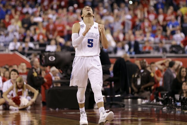 Duke's Tyus Jones reacts during the second half of the NCAA Final Four college basketball tournament championship game against Wisconsin Monday, April 6, 2015, in Indianapolis. Duke won 68-63. (AP Photo/David J. Phillip)