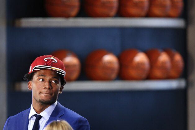 Justise Winslow waits to be interviewed after being selected 10th overall by the Miami Heat during the NBA basketball draft, Thursday, June 25, 2015, in New York. (AP Photo/Kathy Willens)