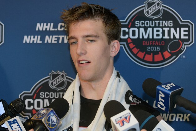 Noah Hanifin talks with reporters after he completed his hockey testing at the NHL Combine, Saturday, June 6, 2015, in Buffalo, N.Y. (AP Photo/Gary Wiepert)