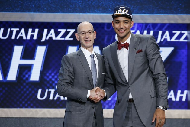 Trey Lyles poses for photos with NBA Commissioner Adam Silver after being selected 12th overall by the Utah Jazz during the NBA basketball draft, Thursday, June 25, 2015, in New York. (AP Photo/Kathy Willens)