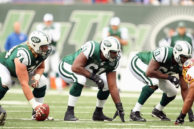 EAST RUTHERFORD, NJ - NOVEMBER 04: Nick Mangold #74, Adrien Clarke #61 and D'Brickashaw Ferguson #60 of the New York Jets get ready on the line against the Washington Redskins during their game on November 4, 2007 at Giants Stadium in East Rutherford, New Jersey. (Photo by Al Bello/Getty Images)