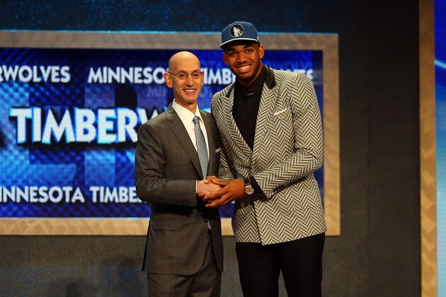 NEW YORK, NY - JUNE 25: Karl-Anthony Towns poses with Commissioner Adam Silver after being drafted first overall by the Minnesota Timberwolves in the First Round of the 2015 NBA Draft at the Barclays Center on June 25, 2015 in the Brooklyn borough of  New York City. NOTE TO USER: User expressly acknowledges and agrees that, by downloading and or using this photograph, User is consenting to the terms and conditions of the Getty Images License Agreement.  (Photo by Elsa/Getty Images)